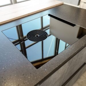inselkueche-modern-betonoptik-grau-bora-kochfeld-muldenlueftung